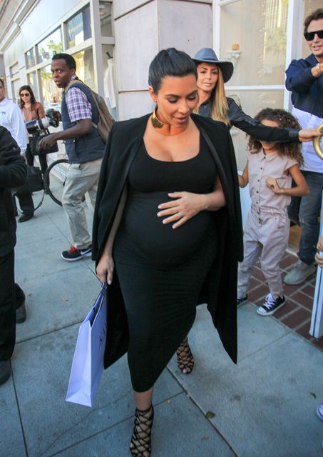 November 2015: Towards the end of her pregnancy, she opted for her classic black dress.