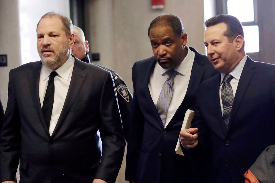 Harvey Weinstein, left, enters court with attorneys Ron Sullivan, center, and Jose Baez, in New York (Mark Lennihan/AP)