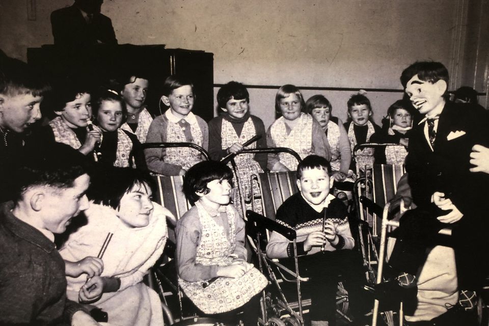 Martin Naughton as a child with the tin whistle (front row, right) at a Christmas party at St Mary's Hospital in Baldoyle, Co Dublin in 1964. His sister Barbara is second from right in the back row. Photo: Lensmen/Irish Photo Archive