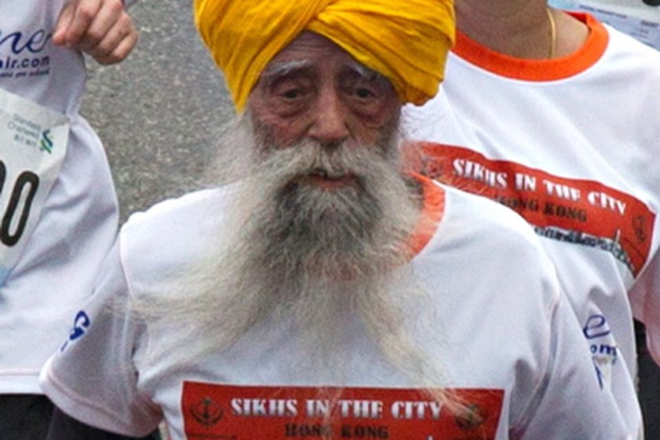 British Indian marathon runner Fauja Singh, 101 years-old,  runs in the 10-km race of the Hong Kong marathon February 24, 2013. Singh will officially retire from public races after Hong Kong marathon. REUTERS/Tyrone Siu (CHINA - Tags: SPORT ATHLETICS)