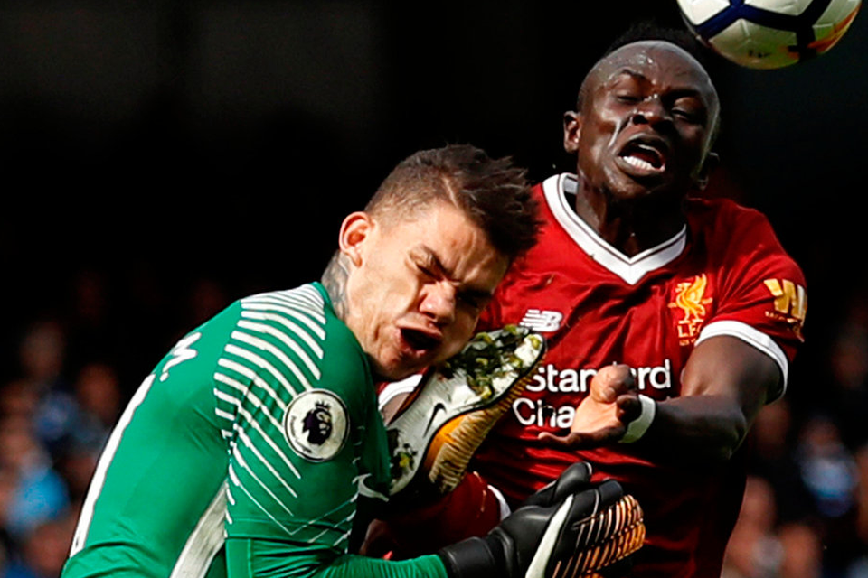 Sadio Mane collides with Manchester City goalkeeper Ederson during yesterday’s game at the Ethihad Stadium in an incident which resulted in a red card for the Liverpool player. Photo: Lee Smith. Photo: Reuters