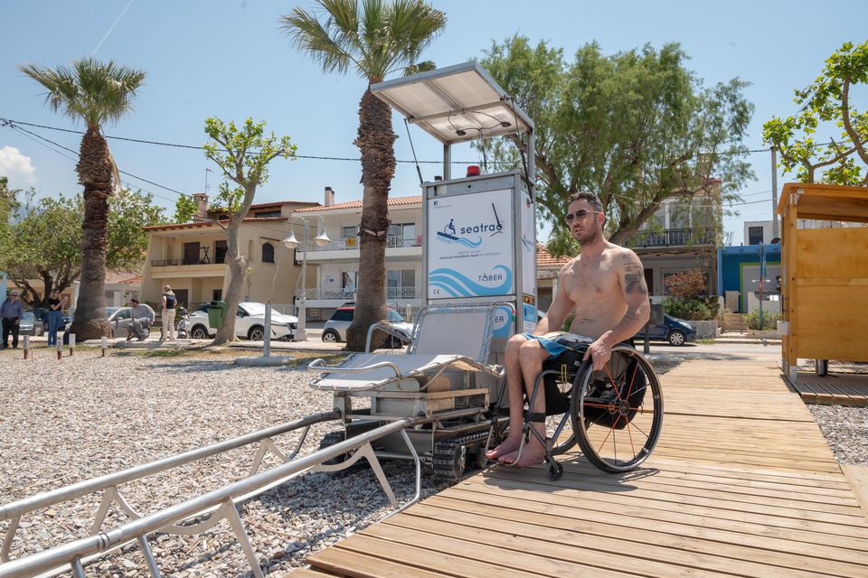At each site, a wheelchair-friendly wooden walkway leads to a chair set on a single track. Users transfer themselves into the recliner and "drive" into the water. Seatrac photo
