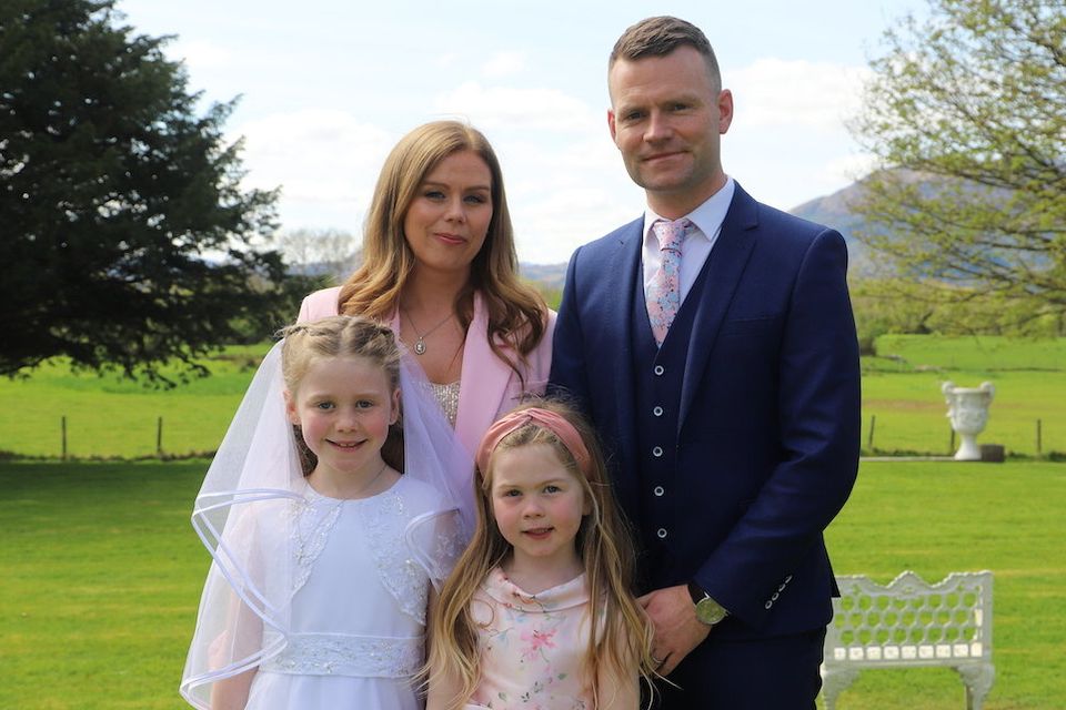 Sadbh Looney from Ballyvourney County Cork who received her First Holy Communion in St. Gobnait’s Church Ballyvourney on Saturday last.Pictured here with her parents who originally come from Killorglin Laura Cahillane and Edward Looney and her sister Siún on the grounds of The Cahernane Hotel Killarney. Photo by Michael G Kenny