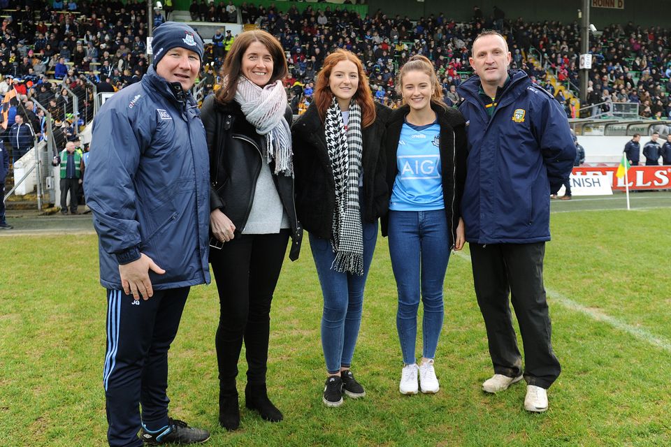 Managers Jim Gavin and Andy McEntee with Martina Cox and daughters Emma and Shauna. Photo: Caroline Quinn