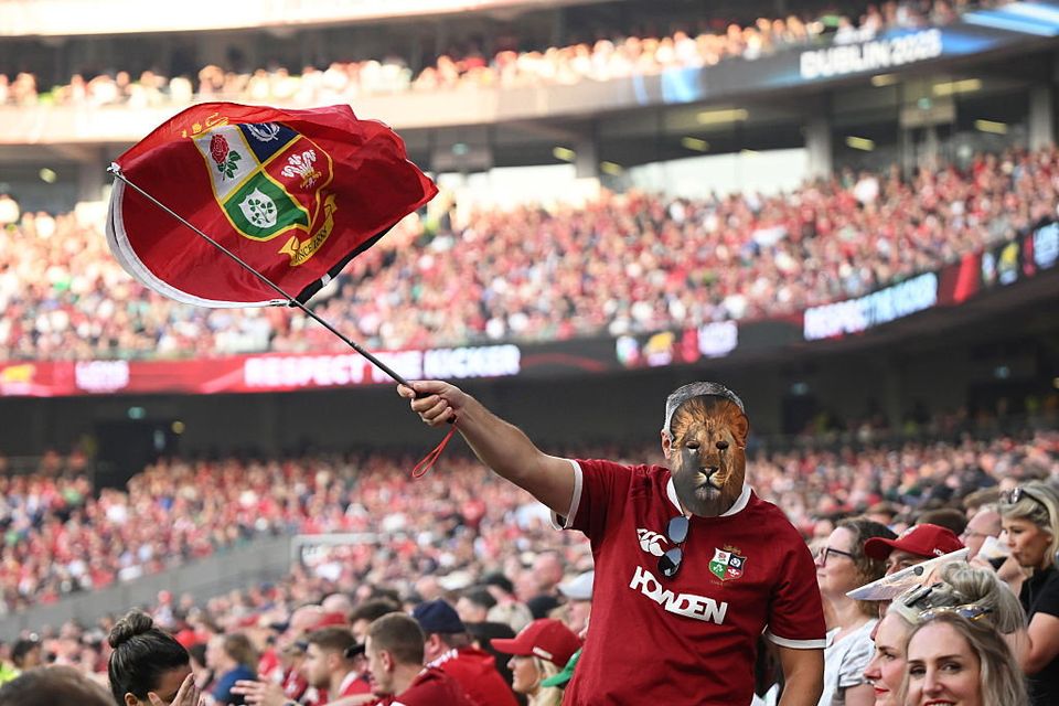 A Lions fan waves a flag whilst wearing a lion mask during the 1888 Cup international match against Argentina at Aviva Stadium in Dublin, Ireland before the 2025 tour of Australia. (Photo by Charles McQuillan/Getty Images)