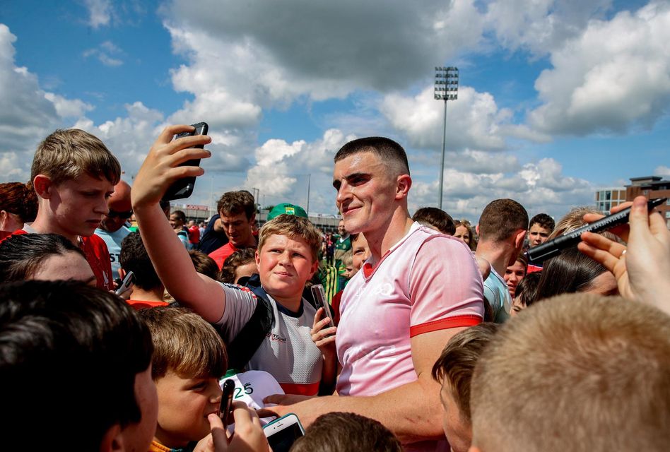 Seán O'Shea poses for pictures with supporters after the All-Ireland SFC Group 1 Round 3 game against Louth in Portaloise