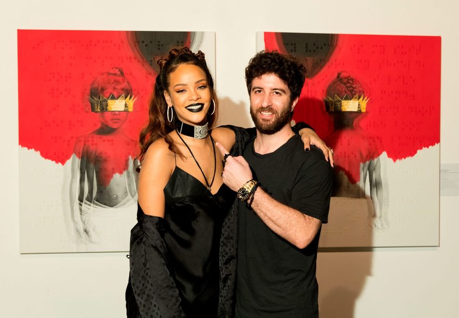 LOS ANGELES, CA - OCTOBER 07:  Singer Rihanna (L) and artist Roy Nachum at Rihanna's 8th album artwork reveal for "ANTI" at MAMA Gallery on October 7, 2015 in Los Angeles, California.  (Photo by Christopher Polk/Getty Images for WESTBURY ROAD ENTERTAINMENT LLC)