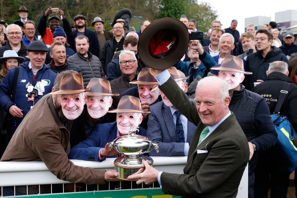 Willie Mullins and fans celebrate after Minella Cocooner’s victory at Sandown. Picture by Steven Paston