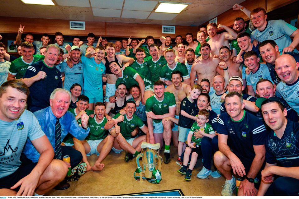 The Limerick players and officials, including chairman of their county board Séamus McNamara, celebrate with the Mick Mackey Cup. Photo: Ray McManus/Sportsfile