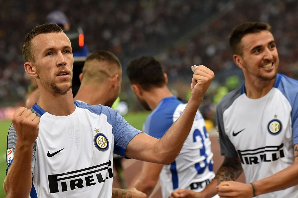 Ivan Perisic (L) of FC Internazionale celebrates the goal 1-3  scored by  Matias Vecino of FC Internazionale during the Serie A match between AS Roma and FC Internazionale at Stadio Olimpico on August 26, 2017 in Rome, Italy.  (Photo by Giuseppe Bellini/Getty Images)
