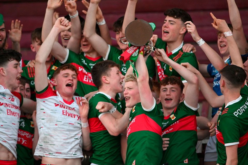Mayo captain Rio Mortimer lifts the cup alongside his teammates