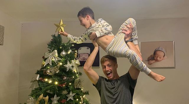 Eoin Doyle and his eldest son Danny put up the Christmas decorations in their Liverpool home