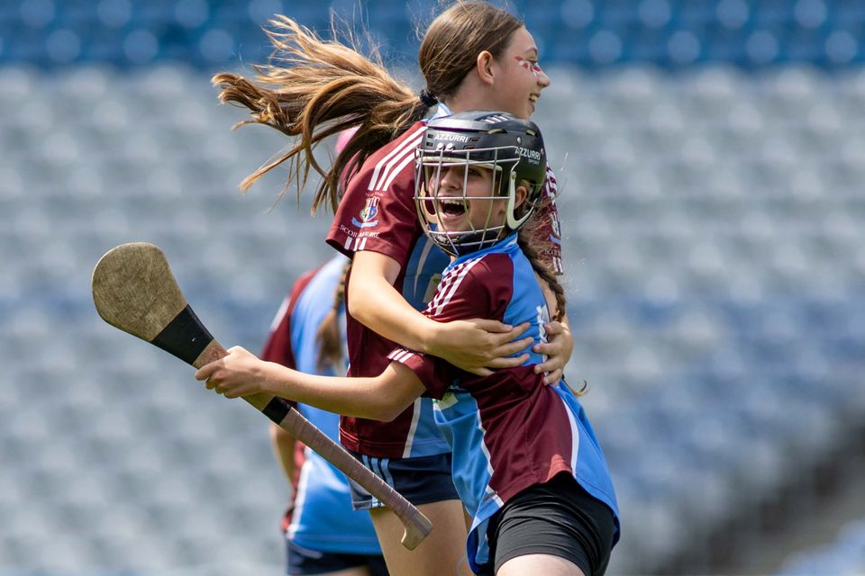 Corn Nua: Scoil Mhuire Woodview girls celebrate after their game with Scoil Chrónáin, Ráth Cúil.