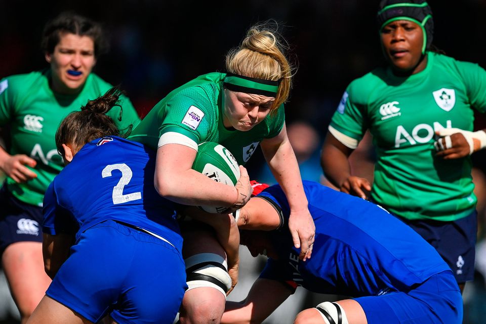 Ireland's Sam Monaghan of Ireland is tackled by Agathe Sochat and Audrey Forlani of France during the TikTok Women's Six Nations Rugby Championship at Musgrave Park in Cork. Photo by Brendan Moran/Sportsfile