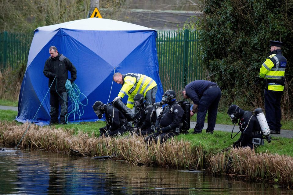 Grim discovery: Members of the Garda Sub-aqua Unit at the Grand Canal where body parts were found. Photo: Brian Lawless/PA Wire