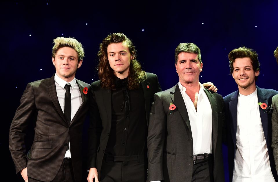Cowell with One Direction members Niall Horan, Harry Styles, Louis Tomlinson and Liam Payne (Ian West/PA)