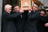 thumbnail: Grandson, Mikey Quinn, right helps to carry the coffin from St Marys Church, Killenaule, Co. Tipperary after the funeral of Billy Quinn