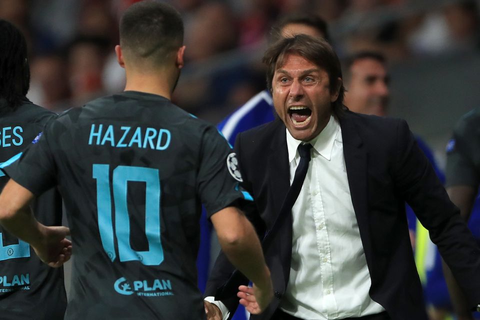 Chelsea's manager Antonio Conte, right, celebrates the first goal against Atletico Madrid with Eden Hazard