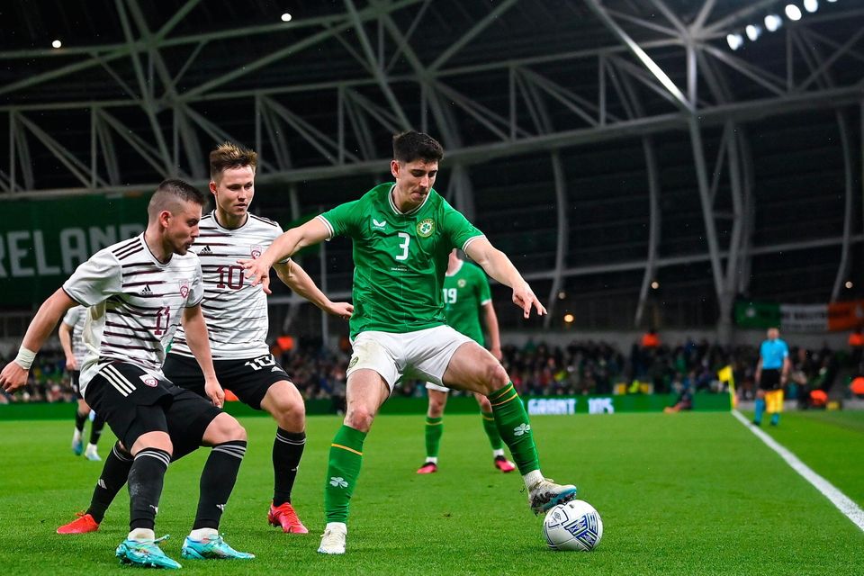 Ireland's Callum O’Dowda in action against Roberts Savalnieks and Janis Ikaunieks of Latvia during their international friendly at the Aviva Stadium last night. Photo: Seb Daly/Sportsfile