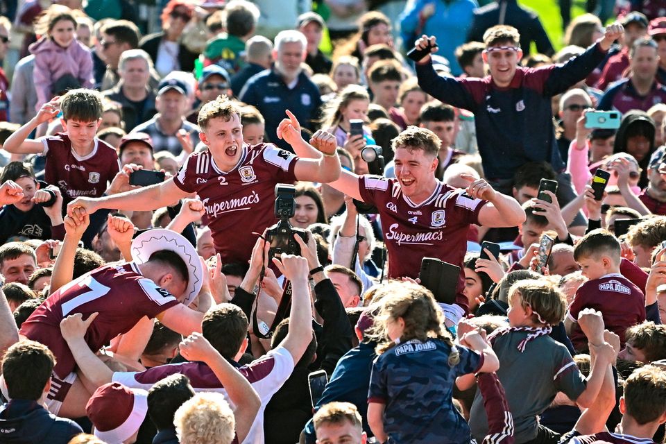 Galway players, including Jack Glynn and Johnny McGrath, celebrate with supporters