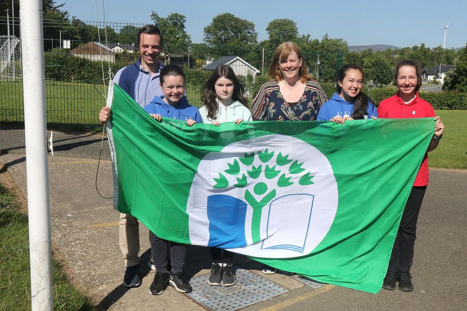 St.  Colman's NS Ballindaggin second Green Flag raising (Biodiversity).  lr: principal Conor McDonald Lily Doyle, Katie Ann Murphy, Ms.  Aislinn Whitty, Niomie King and Nellie Fortune.