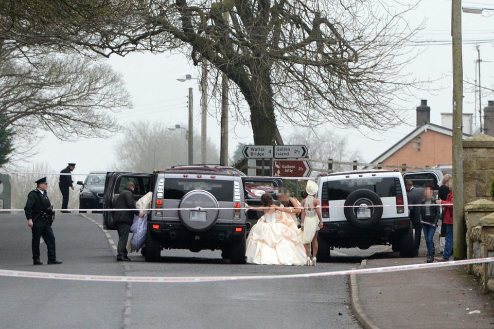 Members of the wedding party leave the church after the shooting. Photo: Ronan McGrade