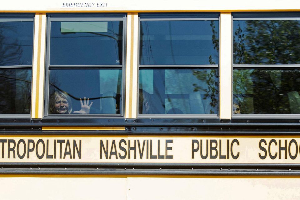 A child weeps while on the bus leaving The Covenant School in Nashville, Tennessee, following a mass shooting yesterday. Photo: Nicole Hester/via Reuters
