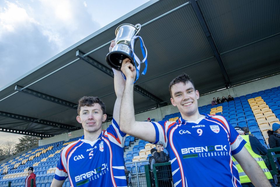 Barndarrig joint captains Michael Owen Byrne and Shane Whelan lift the Junior 'A' hurling championship cup. 