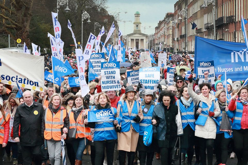 Marchers head through Merrion Square in central Dublin yesterday at a rally in support of nurses’ and midwives’ pay campaign. Picture: Frank McGrath