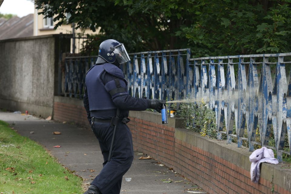 A garda at the scene of disturbances outside the former Crown Paints factory in Coolock Dublin. Photo: Colin Keegan/Collins Photos