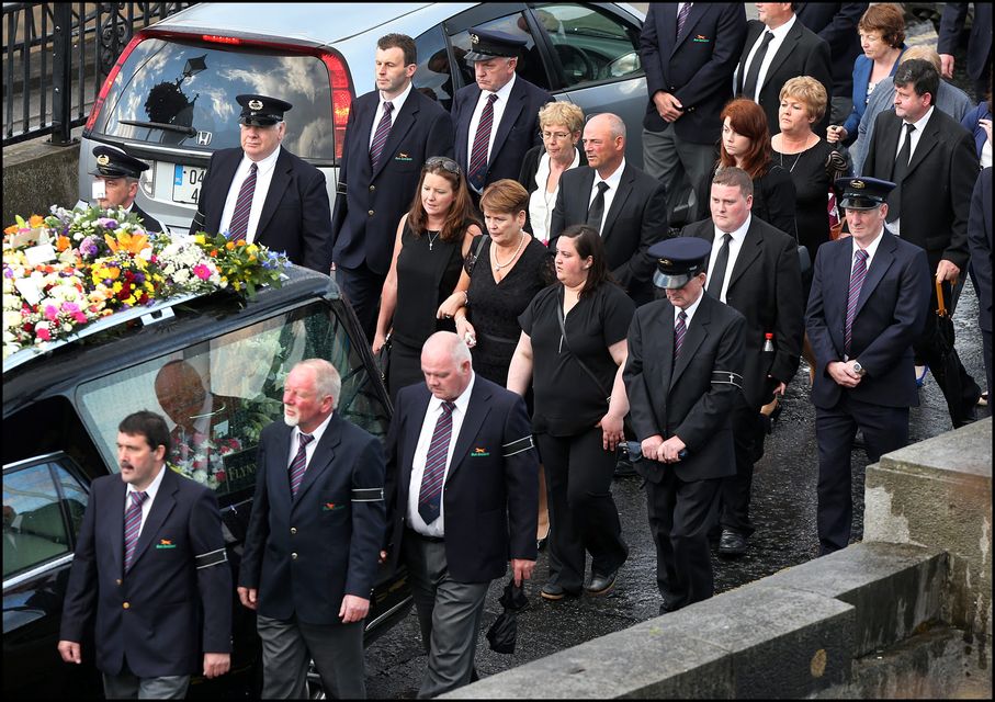 The remains of Larry and Martina Hayes are brought across the Shannon to the Church of St Peter and Paul, where their funeral mass will take place today. Photo: Steve Humphreys