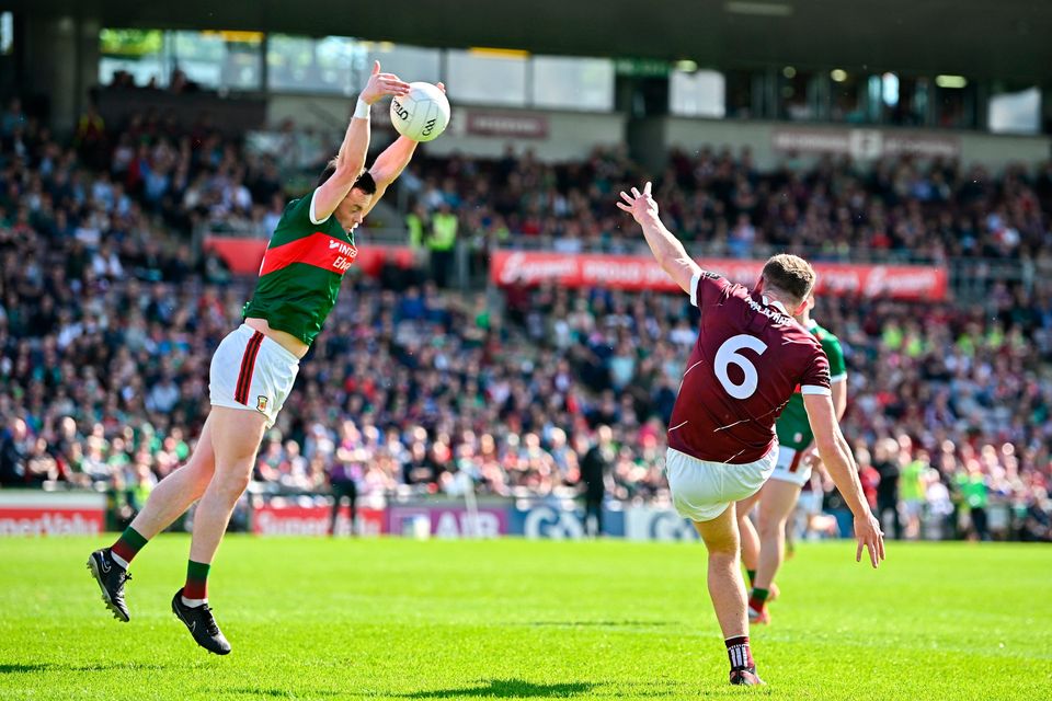 John Daly of Galway has a kick blocked by Stephen Coen of Mayo during the Connacht SFC final at Pearse Stadium in Galway. Photo: Seb Daly/Sportsfile