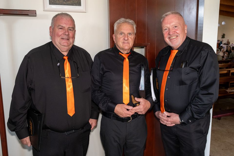 Chairperson of Voices of Bray choir, Kevin Hoey with David Murphy and Iain Cuthbertson. Photo: Leigh Anderson