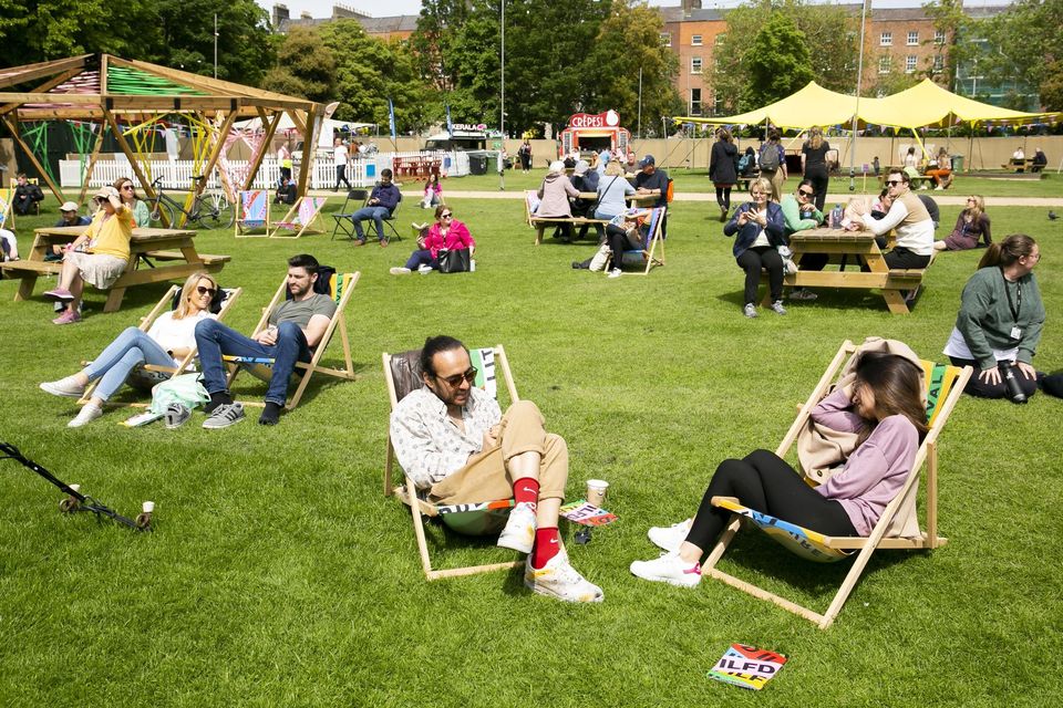 People make the most of the good weather this week during the International Literature Festival Dublin in Merrion Square. Photo: Gareth Chaney/Collins
