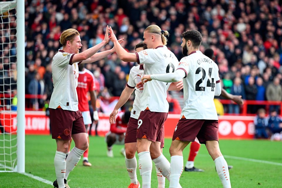 Erling Haaland of Manchester City celebrates scoring his team's second goal against Nottingham Forest with teammates Kevin De Bruyne and Josko Gvardiol