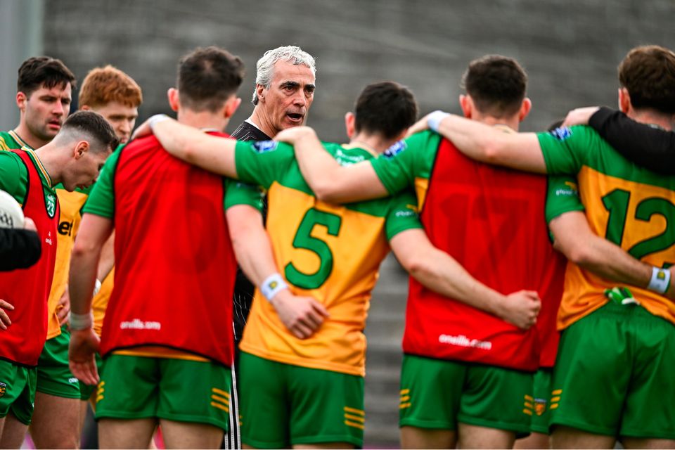 Jim McGuinness talking to his players on the St Tiernach’s Park pitch in Clones before Donegal’s Ulster SFC semi-final win over Down. Photo: Ben McShane/Sportsfile