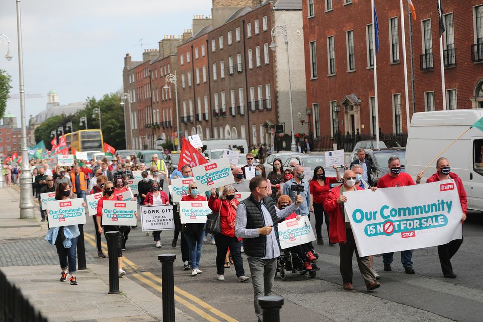 Members of the trade union SIPTU protest against the government’s Job Path scheme outside the Government Buildings in Dublin (Niall Carson/PA)
