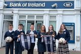 thumbnail: Isaac Carcone, Matthew Ryan, Lucy Tyndall and Faith Cassidy Canavan are presented with the new Greystones Community College football jerseys by Bank of Ireland Greystones staff.