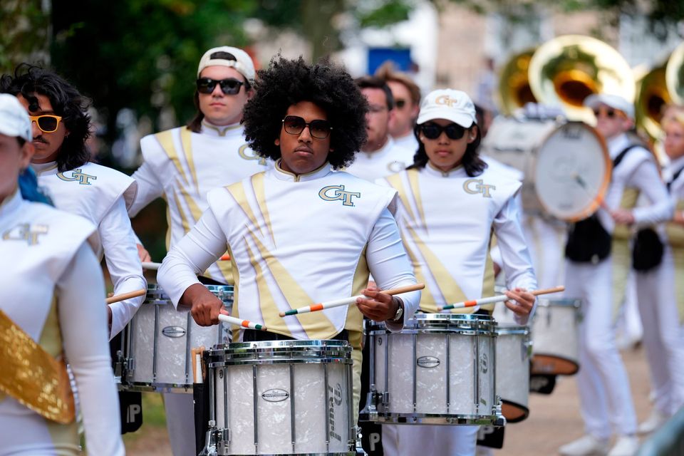 The Georgia Tech Yellow Jacket marching band arrives in Merrion Square, Dublin, to perform at the Georgia Tech Helluva Block Party Pep Rally as part of the build up to Saturday’s Aer Lingus College Football Classic, US College football match in Dublin. Photo: Brian Lawless/PA Wire