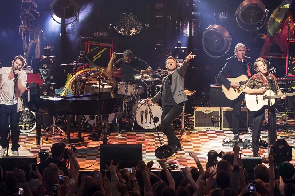 Howard Donald, Gary Barlow and Mark Owen perform on stage at Roundhouse, Camden, north London as part of the Apple Music Festival