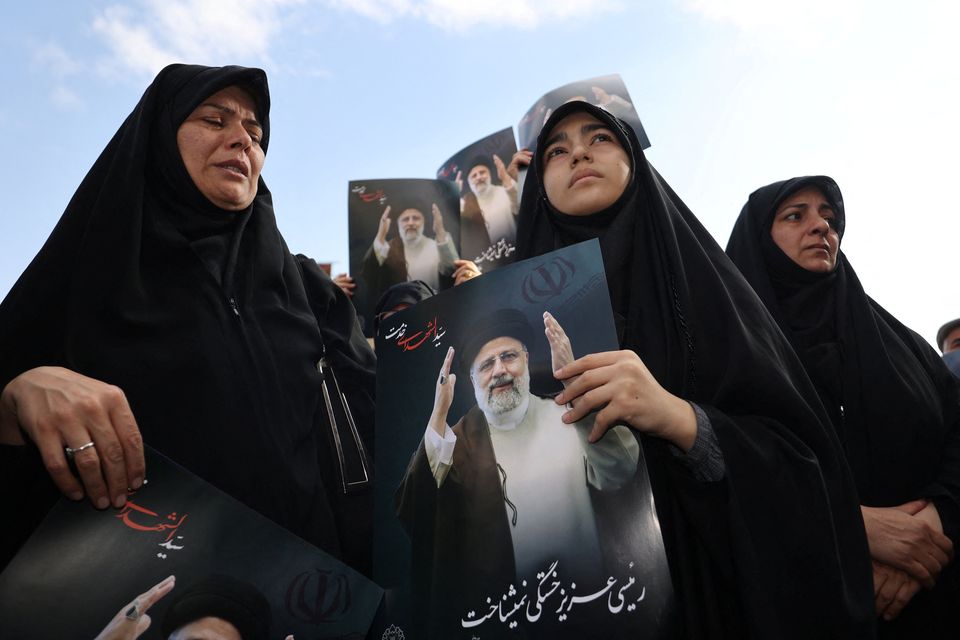 People gather in Tehran yesterday to mourn the death of Iranian president Ebrahim Raisi. Photo: Reuters
