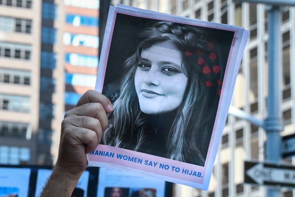 A photo of Iranian woman Mahsa Amini is held up at a protest in New York in solidarity with Iranian women. Getty