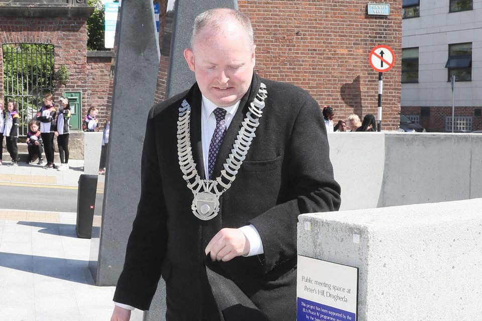 Conor Keenan, Chairman of Louth Co. Co. unveils a plaque at the official opening on Monday. 