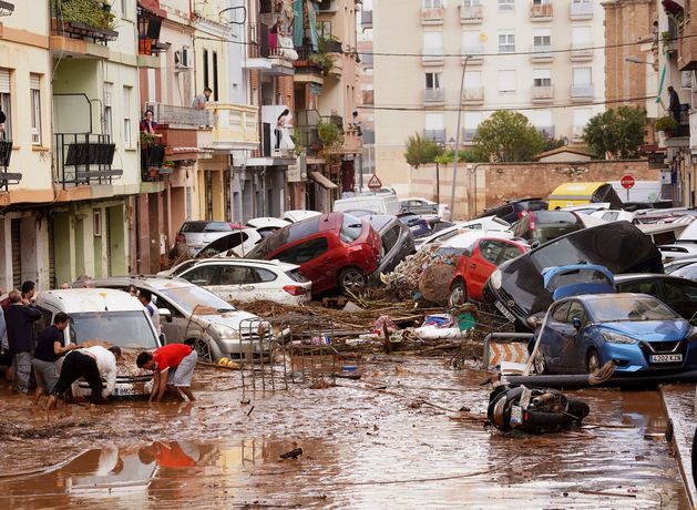 ‘The whole of Spain weeps with you’ – at least 95 dead as flash floods sweep Valencia