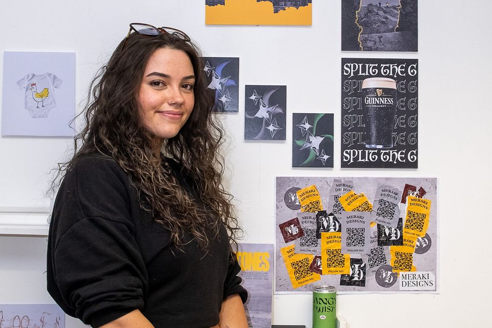 Amie Webster with her work. 