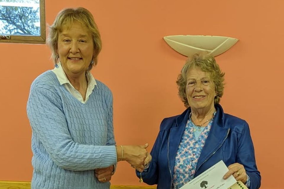 At the presentation of prizes for the May Bush Competition in Teach Raithneach was competition Judge Josephine Sullivan presenting 3rd Prize to Nancy Roche.