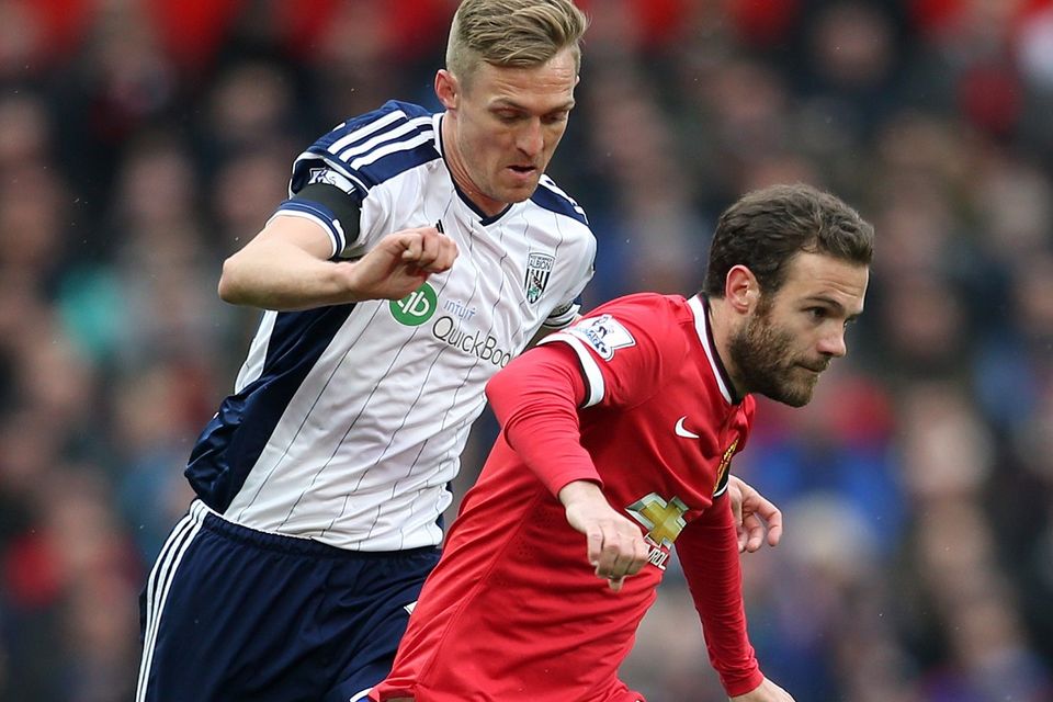 Mata (right) is chased by West Brom's Darren Fletcher during Saturday's match at Old Trafford
