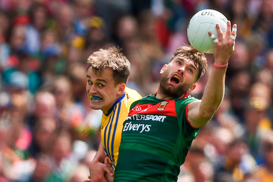 Mayo’s Aidan O’Shea holds off Roscommon’s Enda Smith during the All-Ireland SFC quarter-final replay at Croke Park yesterday. Pic: Sportsfile