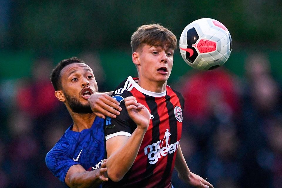 14-year-old Evan Ferguson in action for Bohemians against Lewis Baker of Chelsea during a friendly match played between the sides at Dalymount Park in July 2019.