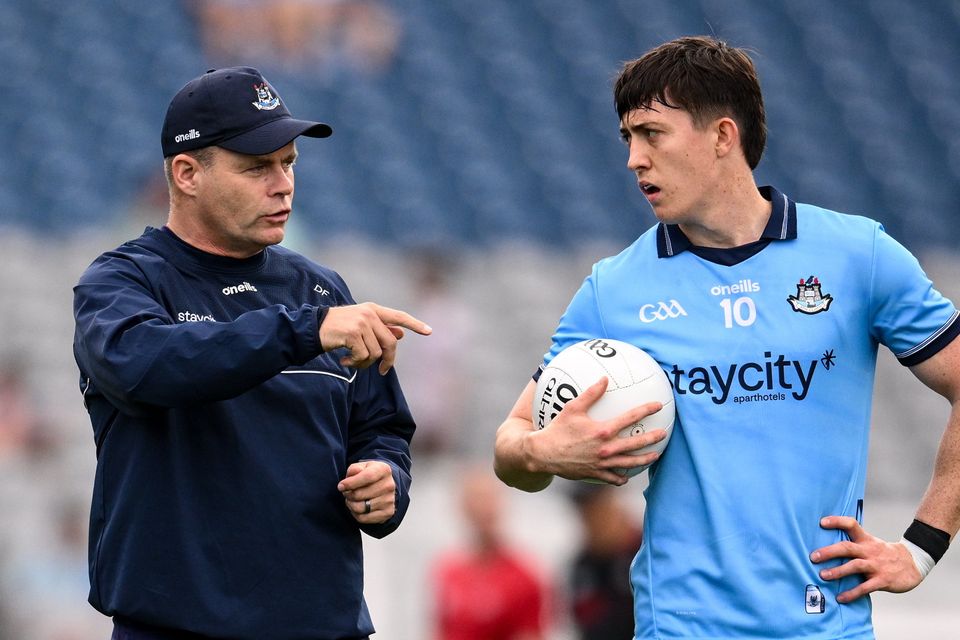 Dublin manager Dessie Farrell and Killian McGinnis. Photo: Sportsfile